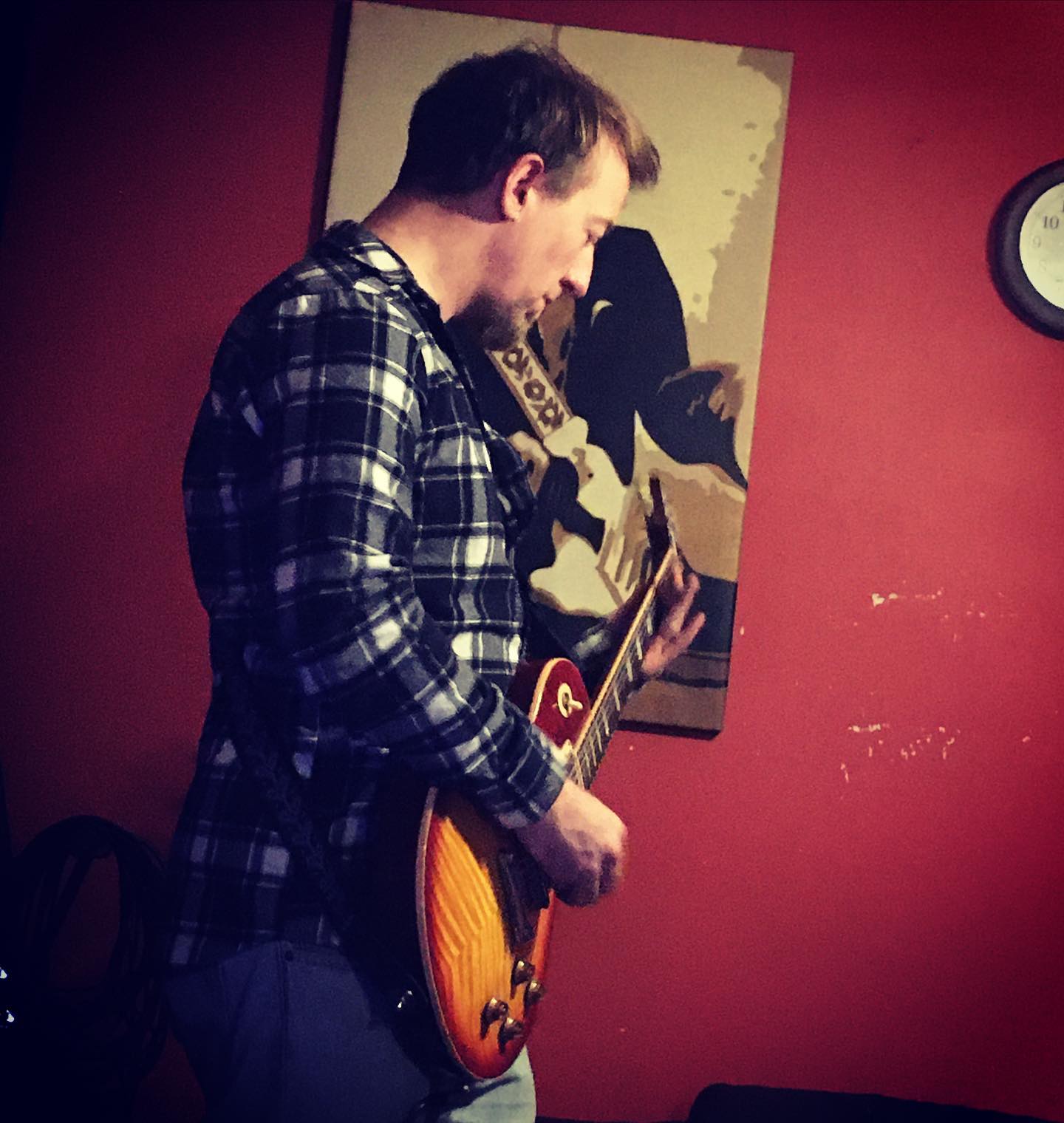 Moe recording guitar tracks in the studio