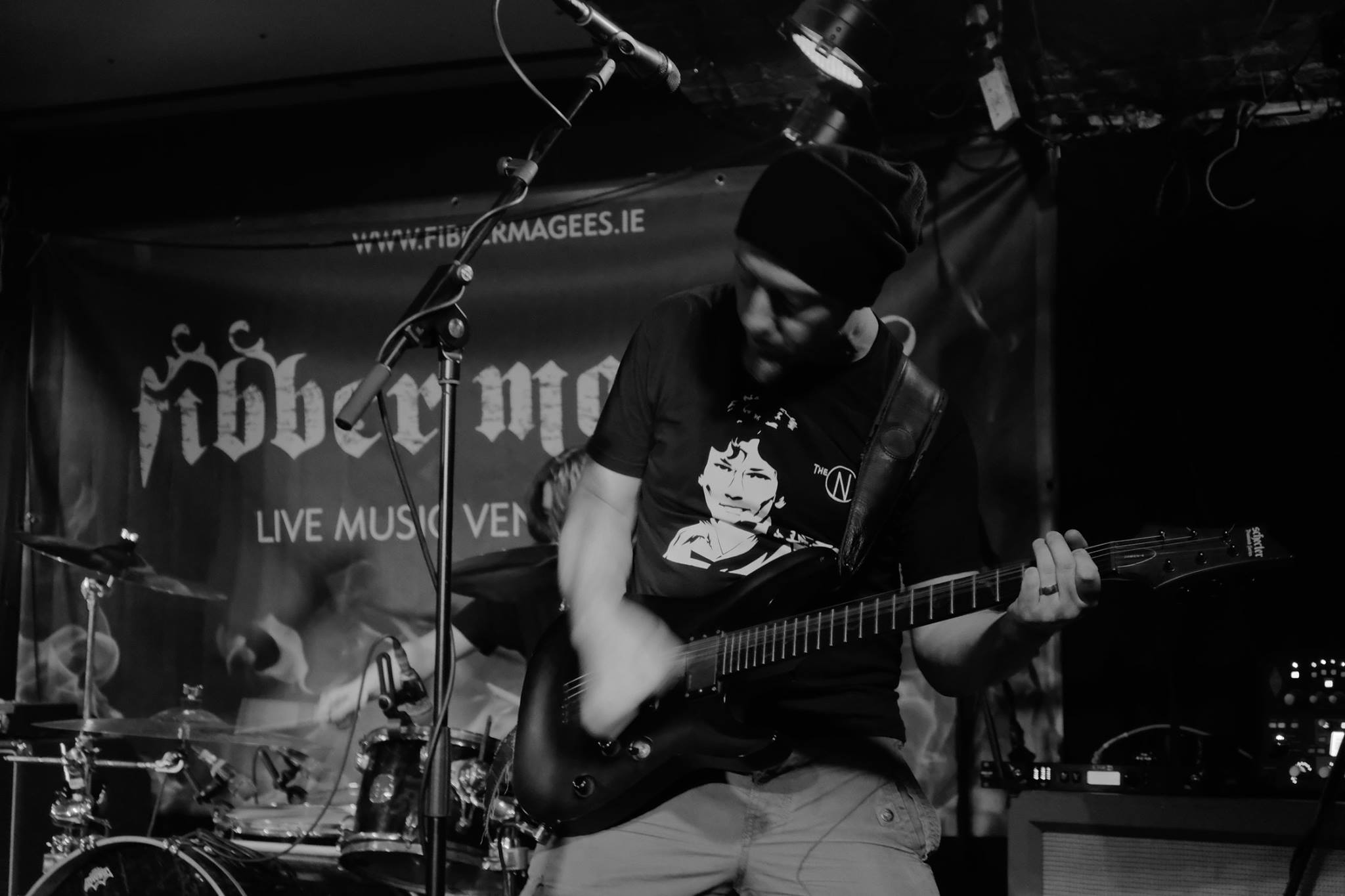 A black and white shot of Moe playing furiously