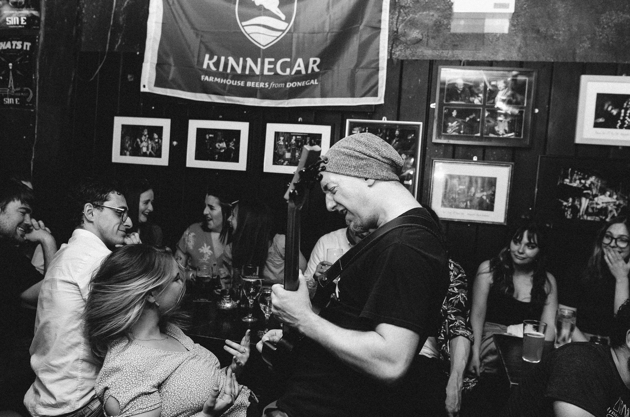 Moe Curtin playing guitar in the crowd